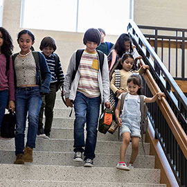 Students walking down stairs