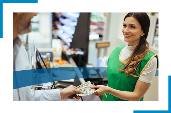 A women handling cash at the store