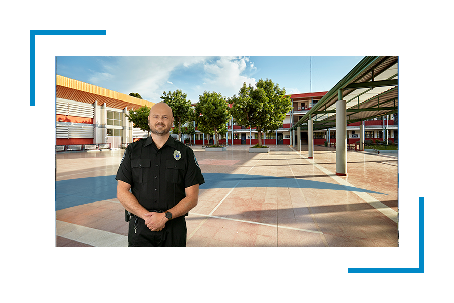 Allied Universal Security guard in uniform in a school