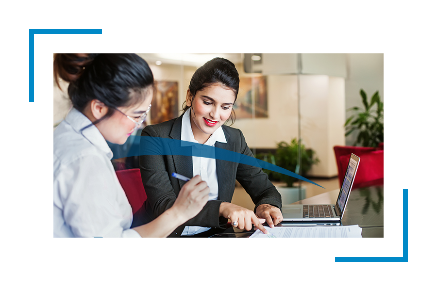 Two women discussing the documents- workforce solutions, staffing agency, staffing solutions